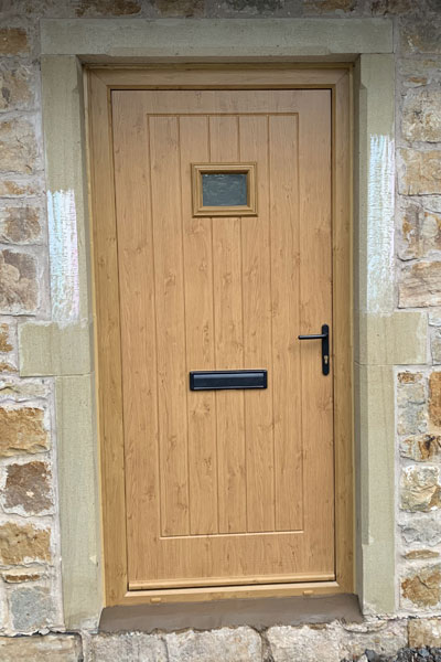 Wooden front door at Wrexham home