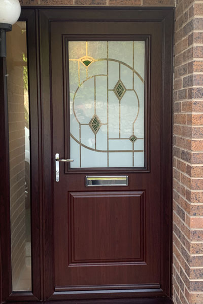 Composite door with glass front